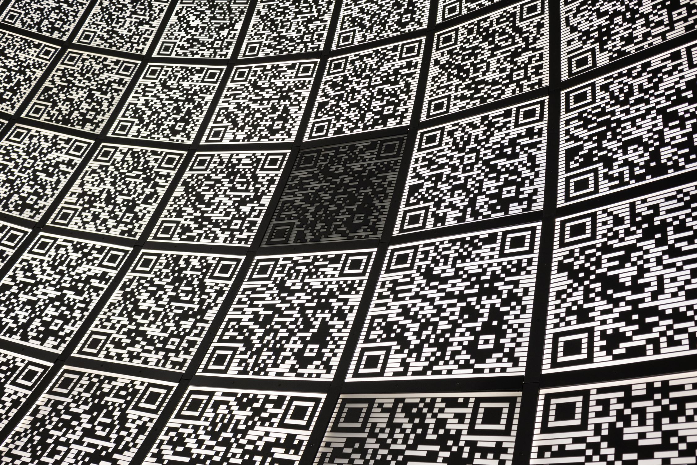 Abstract QR codes represent financial analysis of product profitability.